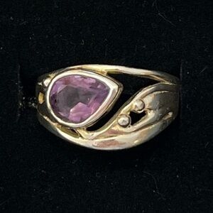 Sterling silver ring with purple stone. Size 8